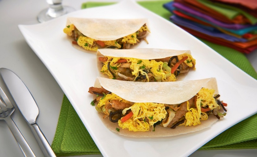 Scrambling eggs for easy moo shu vegetable recipe