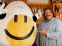 Matty Matheson standing next to Coco, the Get Cracking brand mascot.